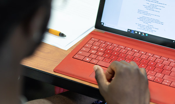  Student at red computer 