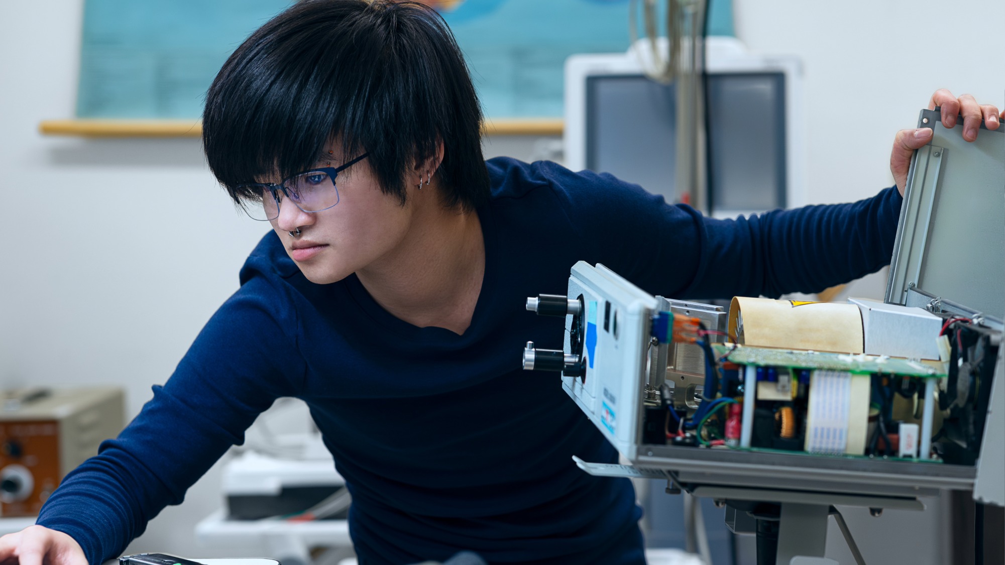 Biomedical Equipment Technology student in class working