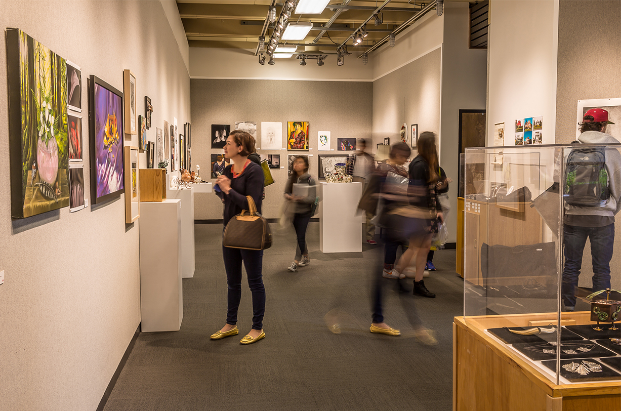 Student looks at art