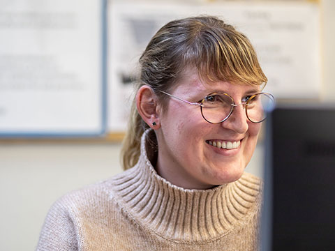 math teacher looking at computer