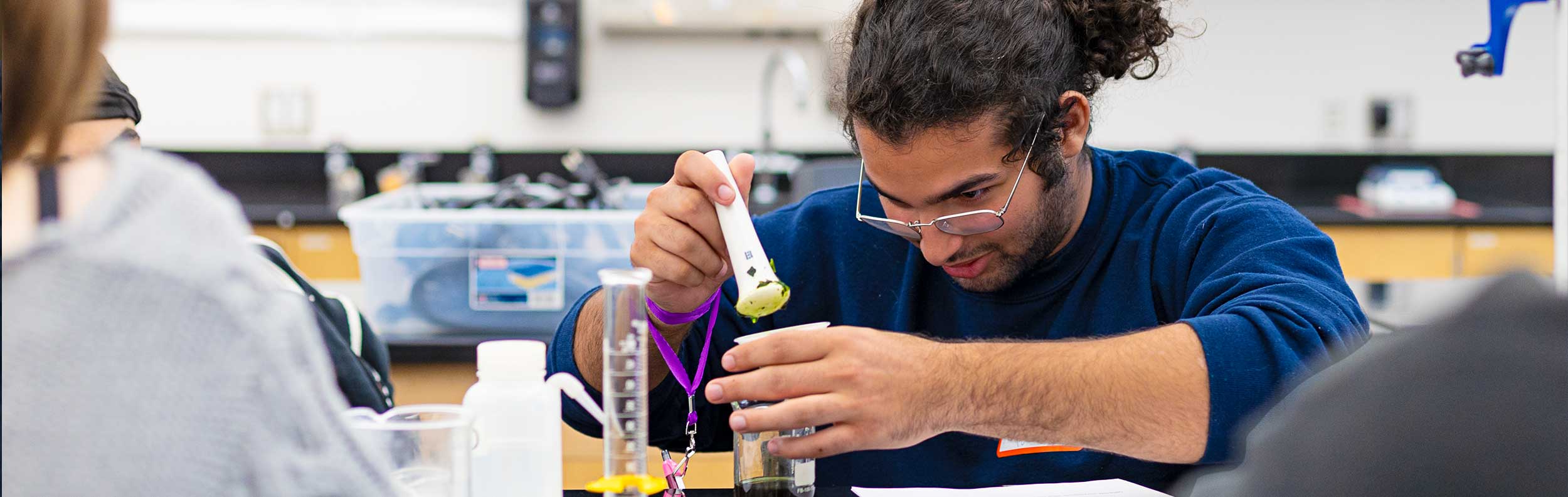  male student in a science classroom 
